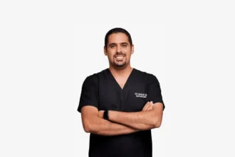Patient discussing invisible braces treatment with an orthodontist in Dubai